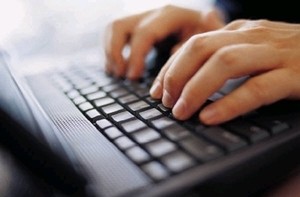 Image of a fitness blogger and writer working on an assignment.