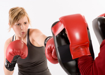 Image of a client doing cardio kickboxing.