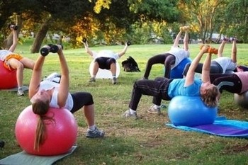 Image of participants engaged in a practical, hands-on fitness workshop.