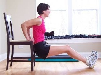Photo of a fitness client exercising at home.
