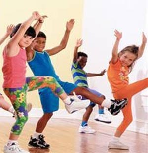 Photo of a bunch of kids exercising during a fitness session.