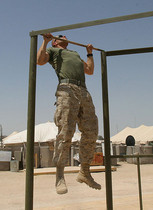 Photo of a recruit undergoing physical fitness conditioning in the military.