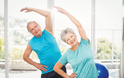 image of mature couple exercising together