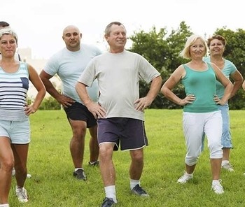 Image of a group of older adults doing movement training.