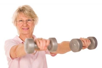 Image of an older lady training with weights.