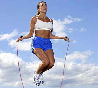 Photo of a female client enjoying an outdoor fitness workout.