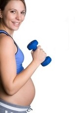 Picture of pre-post natal fitness client in action.