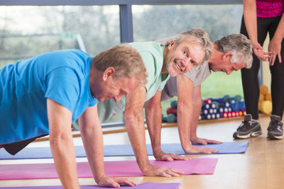 Image of a group of older men partaking in a group fitness class.